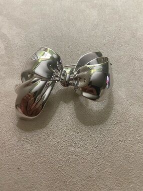 Vintage MONET silver shiny bow designer runway brooch